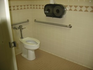 Restroom stall with grab bars