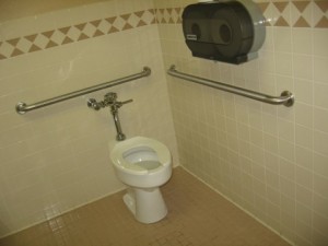 Restroom stall with grab bars